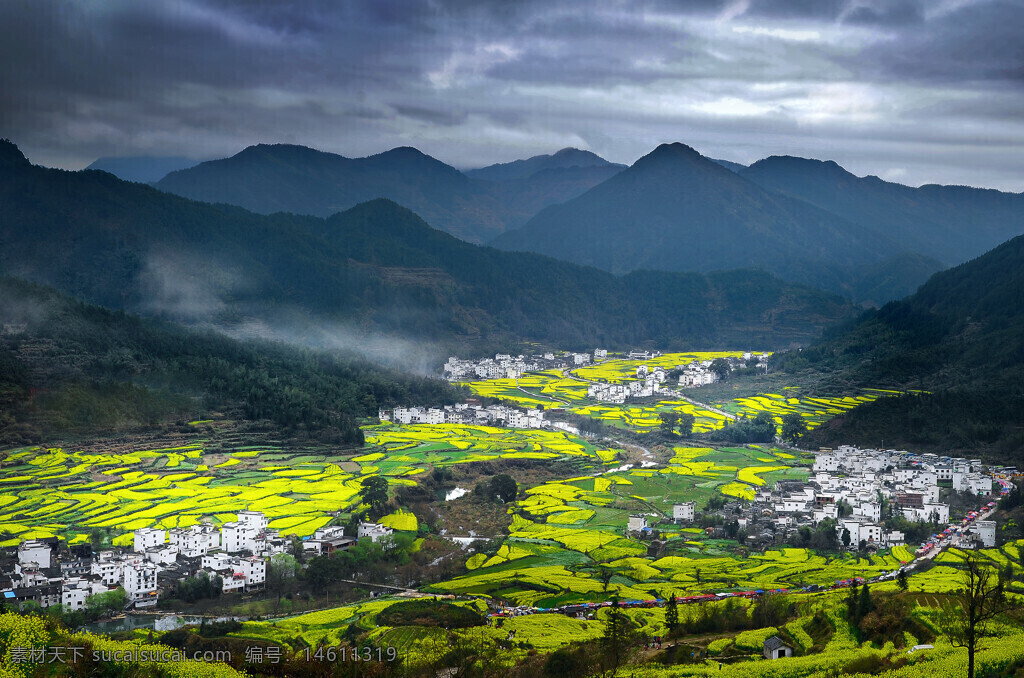 油菜花田 连绵山脉 乡村风光 自然景观 春季景色 村庄建筑 乌云密布 山间雾气 宁静乡村 金黄花海 远山风光 田园风光 中国乡村