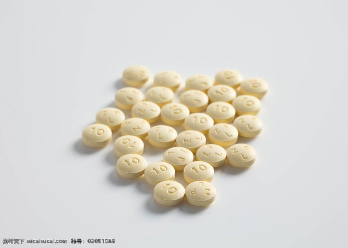 药片 药物 药剂 特写 一堆 俯视 俯看 俯拍 木黄色 黄色 白色 西药 生活百科 生活素材