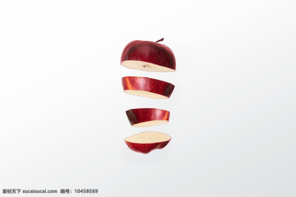 切开的苹果 苹果 切开 切片 切水果 悬浮 无重力 反重力 创意 红色 切割 分割 透视 漂浮 飘着 时尚 潮流 水果 削水果 削苹果 红苹果 瞬间 抓拍 室内 影棚 生物世界